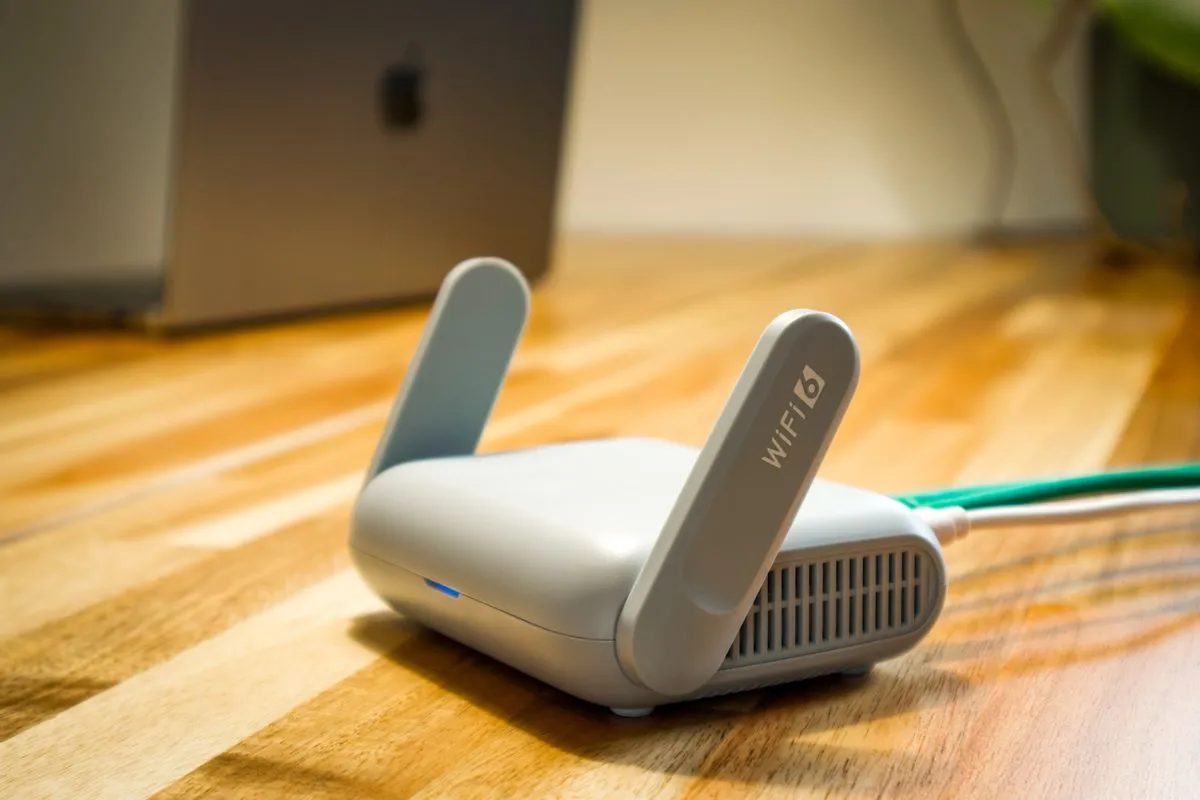 Modern Wi-Fi 6 router on a wooden desk