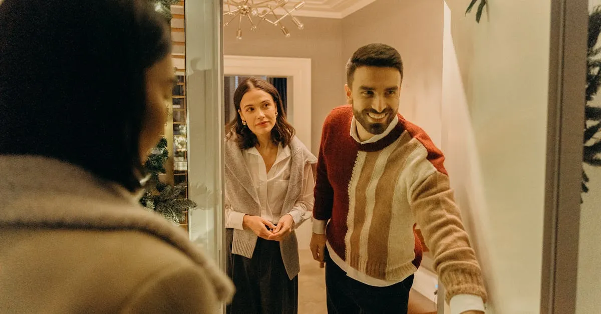 A couple greeting a guest at their doorway, capturing the warmth of a home during the holiday season. - Picture by cottonbro studio