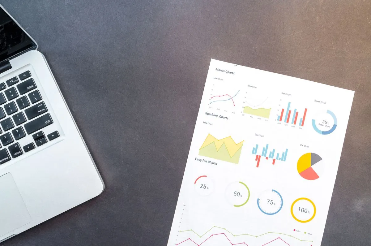 Desk setup with SEO performance charts for a rental website